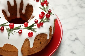 Traditional homemade Christmas cake on white marble table, closeup