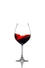 Red wine swirl in a red wine glass isolated on a white background. 