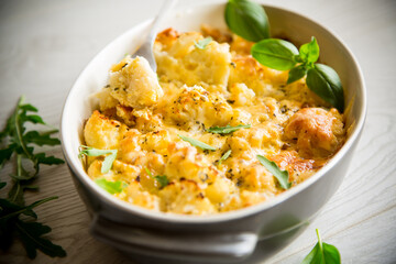 baked cauliflower with vegetables and cheese and scrambled eggs