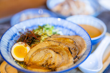 Japanese ramen with slice of grilled pork in bowl