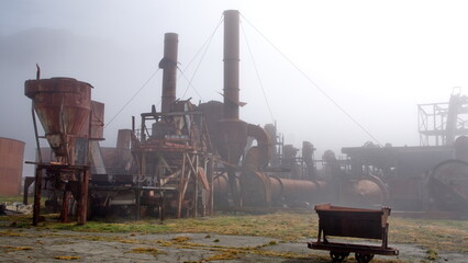 Old, rusted whaling equipment in the fog, at the old whaling station in Grytviken, South Georgia...