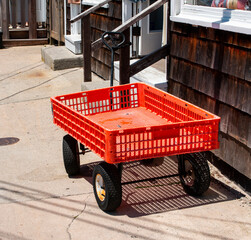 Red wagon left outside a store in Ocean Beach Village on Fire Island