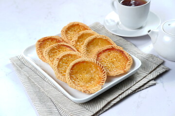 Pie Susu or custard tarts is popular snack from Bali, Indonesia.on white background 