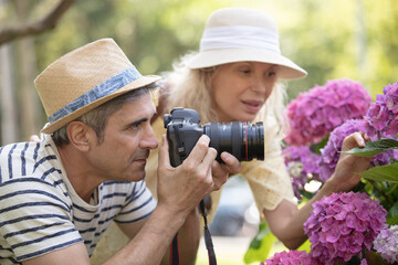 photographer taking pictures of a flower