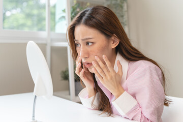 young female have freckles on her face.