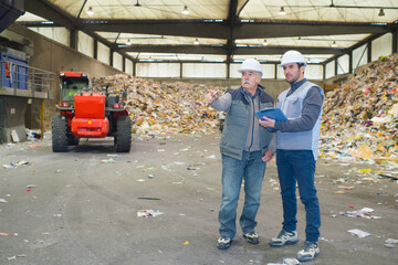 male workers planning in recycling center