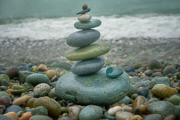Stones stacked one by one, balancing rocks on the seashore