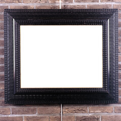 Fototapeta premium Picture frame hung on the wall by a picture rail