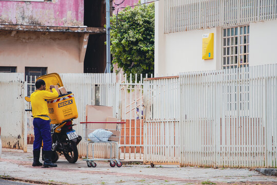 August 18, 2022, Brazil. In this photo illustration, a postman from the Correios organizes the parcels for delivery.