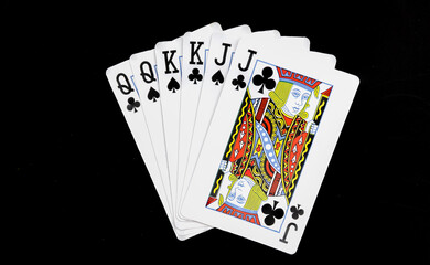 Royal playing cards on a black background.