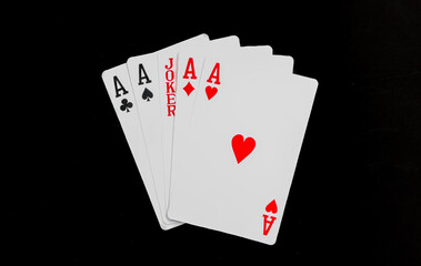 Royal playing cards on a black background.