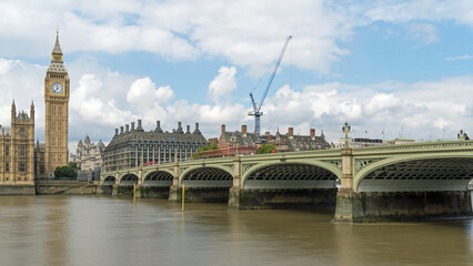 Houses of Parliament and Westminster Bridge in London on a cloudy day 