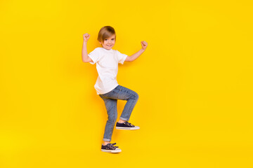 Full length body size view of handsome cheerful lucky pre-teen boy dancing rejoicing isolated over...
