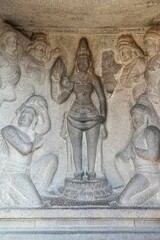Bas relief rock cut sculptures of gods, people and animals are carved prominently in the monolithic cave temples at Mahabalipuram, Tamil nadu, India