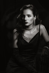 Portrait of woman in classic retro style of black and white Hollywood movies. Girl in vintage look...