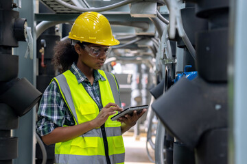 Engineer checking the cooling system of the factory air conditioner.