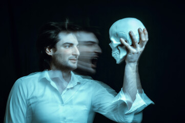 abstract blurry portrait of a psychopathic man with mental disorders with a human skull in his hand...