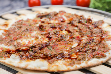 Arabic Manakish with onion, tomato and spices
