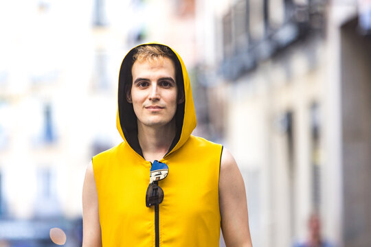 Smiling stylish non binary male on street
