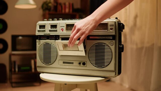 Retro radio tape recorder close-up. Listening to music, old radio boombox player, searching channel. 