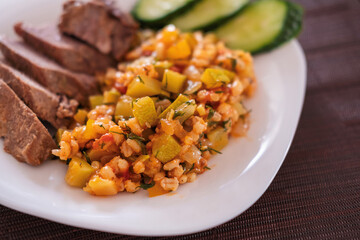 Garnish for bulgur meat with vegetables close-up