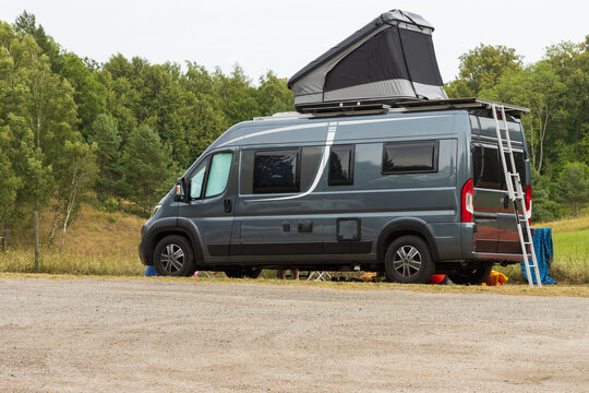 Camper van on a natural campsite  in Sweden.
