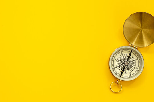 Golden vintag compass top view. Direction choice concept