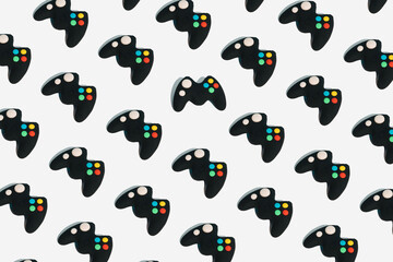 Seamless pattern with gamepads on white background. Creative concept of video game or gaming industry. Isometric view. Break the pattern.