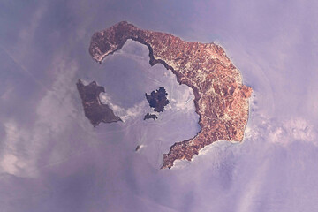 Santorini Island in Aegean Sea. Digital enhancement. Elements by NASA