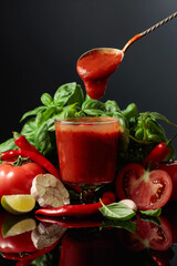 Spicy tomato sauce with ingredients.