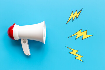 Megaphote with flying out lightning. Hiring or advertising concept