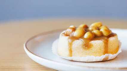Macadamia cake close up on wooden table