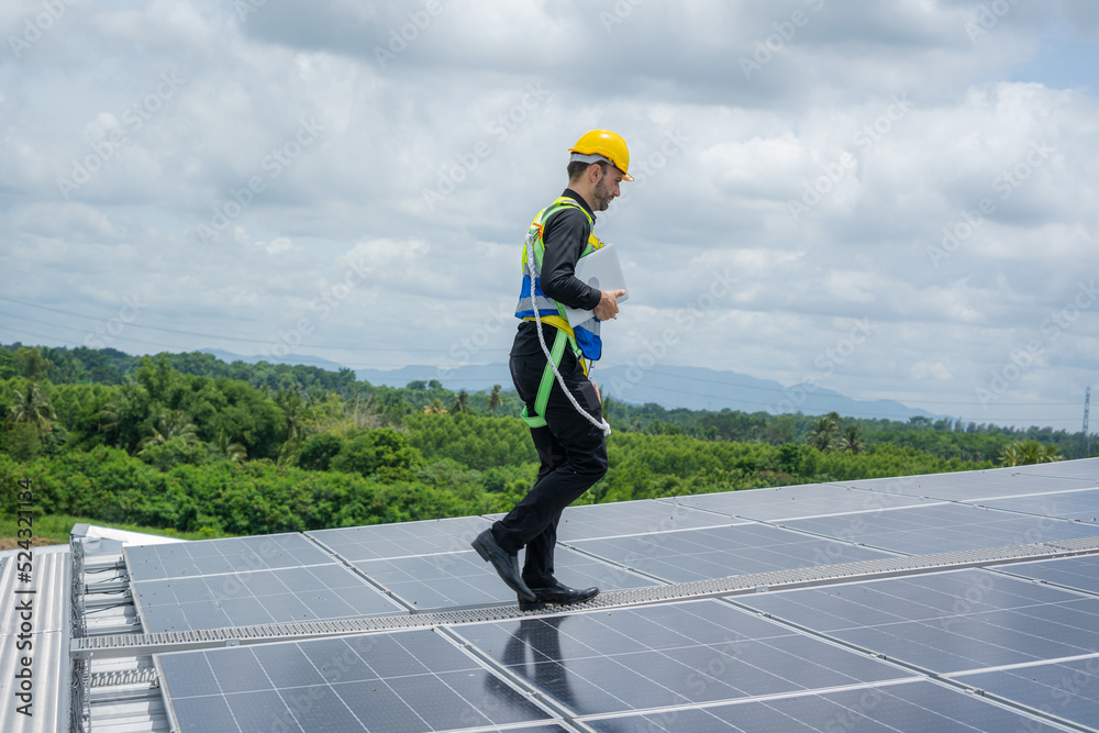 Aufkleber engineers checking the operation of the system solar cell on roof at factory,alternative energy to c
