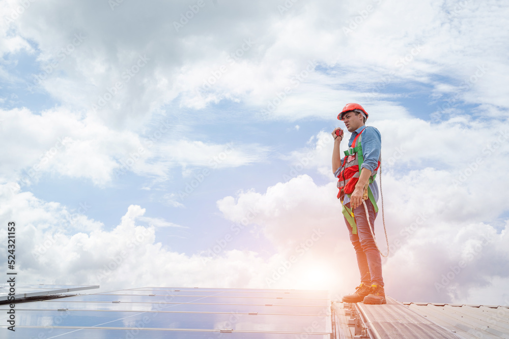 Poster engineers checking the operation of the system solar cell on an building in an residential area,phot