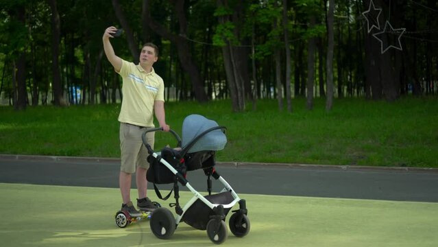 A young dad walks in the park with a stroller on a gyro scooter. A man rides a hoverboard and takes a selfie with his phone.