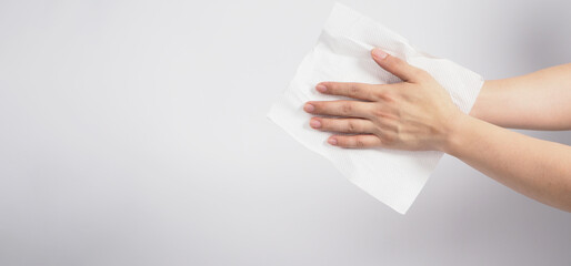 Hand is dry thoroughly with tissue paper on white background.