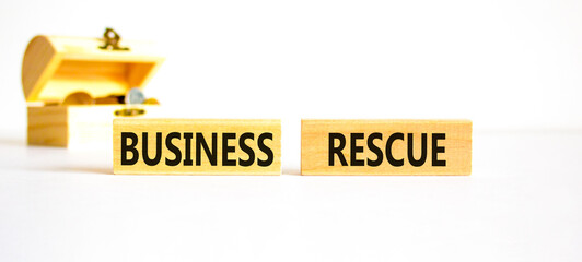 Business rescue symbol. Concept words Business rescue on wooden blocks on a beautiful white table...