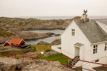 Lindesnes Fyr Lighthouse in Norway on rainy cold day - obrazy, fototapety, plakaty