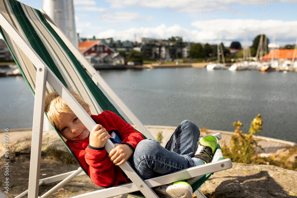 Wall mural Beautiful town Kristiansand in Norway, family visiting Norway for summer vacation