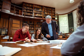 The senior professor gives a lecture to the students