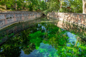 Fototapeta na wymiar Fuente Grande water spring in Alfacar (Granada, Spain), from where the Aynadamar irrigation channel comes out, built by the Arabs of the Zirí dynasty (11th century) to carry water to the Albaicín