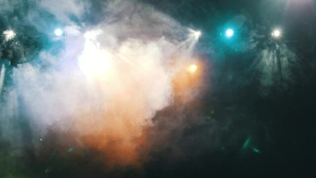 Blue flare light beam with smoke and dust particle effect abstract background.  concert lighting. theatrical installation. 4K abstract light motion titles cinematic background. High quality 4K footage