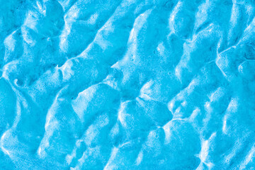 Blue cream texture. The surface of berry yogurt and a smoothie of whipped cream. Background texture...