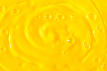 Bubble yellow texture background. Berry gel to cleanse the skin of the face and body. Spa treatments, skin care. Bath foam, detergent. Gold slime
