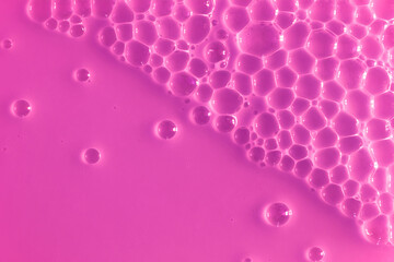 Bubble purple background texture. Berry gel to cleanse the skin of the face and body. Spa treatments, skin care. Bath foam, detergent. Slime pink.