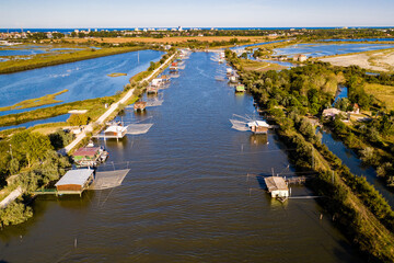 Aerial view of fishing lodges, Comacchio lagoon on sunset, Northern Italy