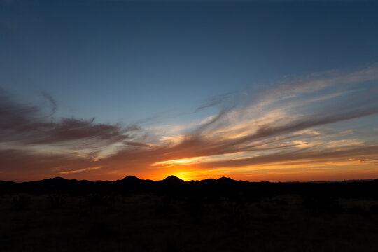 Beautiful and colorful sunrise or sunset mountain horizon silhouette in the Southwest USA like Arizona, New Mexico or Utah