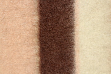 Fototapeta premium Texture of a warm woolen blanket close-up. Abstract background.