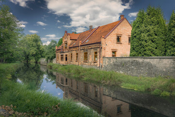 Fototapeta premium Old water mill in the village of Okradzionow, Poland.