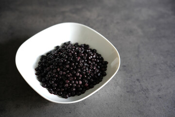 Fototapeta na wymiar Closeup of blueberries, blackberry in bowl